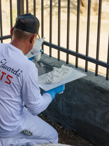 Close-up of professional stucco repair work in Tucson
