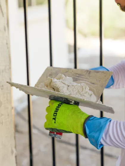 Sunset Coatings crew applying stucco on a Tucson home