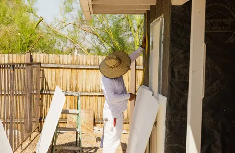 Stucco water barrier installation being measured